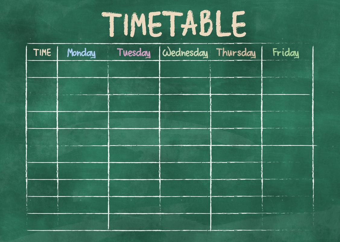 school timetable or class schedule on green classroom chalkboard